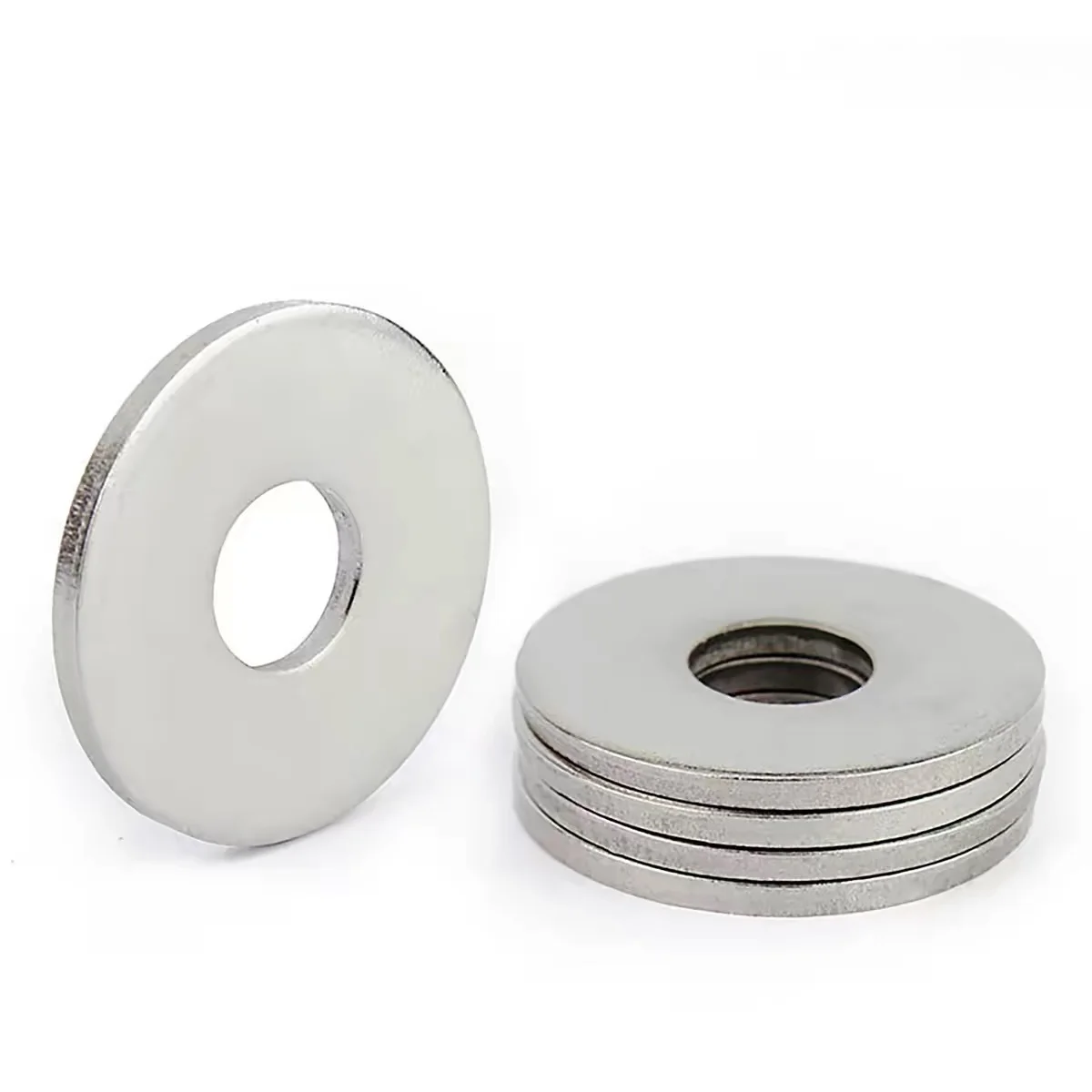 stacked large OD stainless steel fender washers showing thickness and center holes