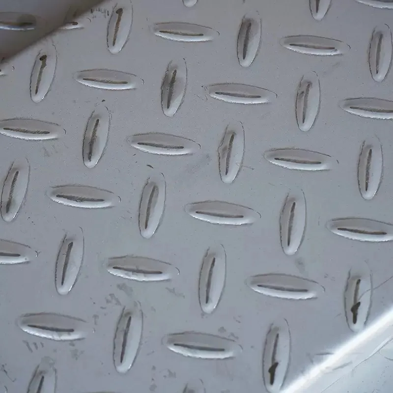 Close-up of the raised anti-slip pattern on stainless steel checker plate