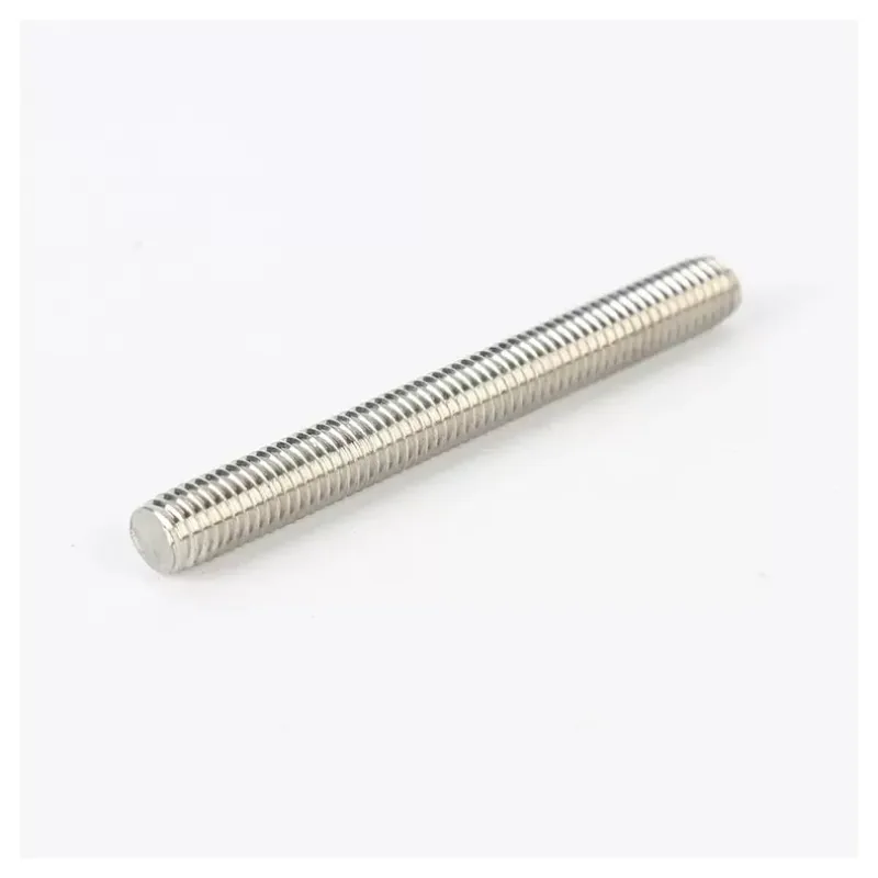 Close-up of continuous external threads and end preparation on a stainless steel rod
