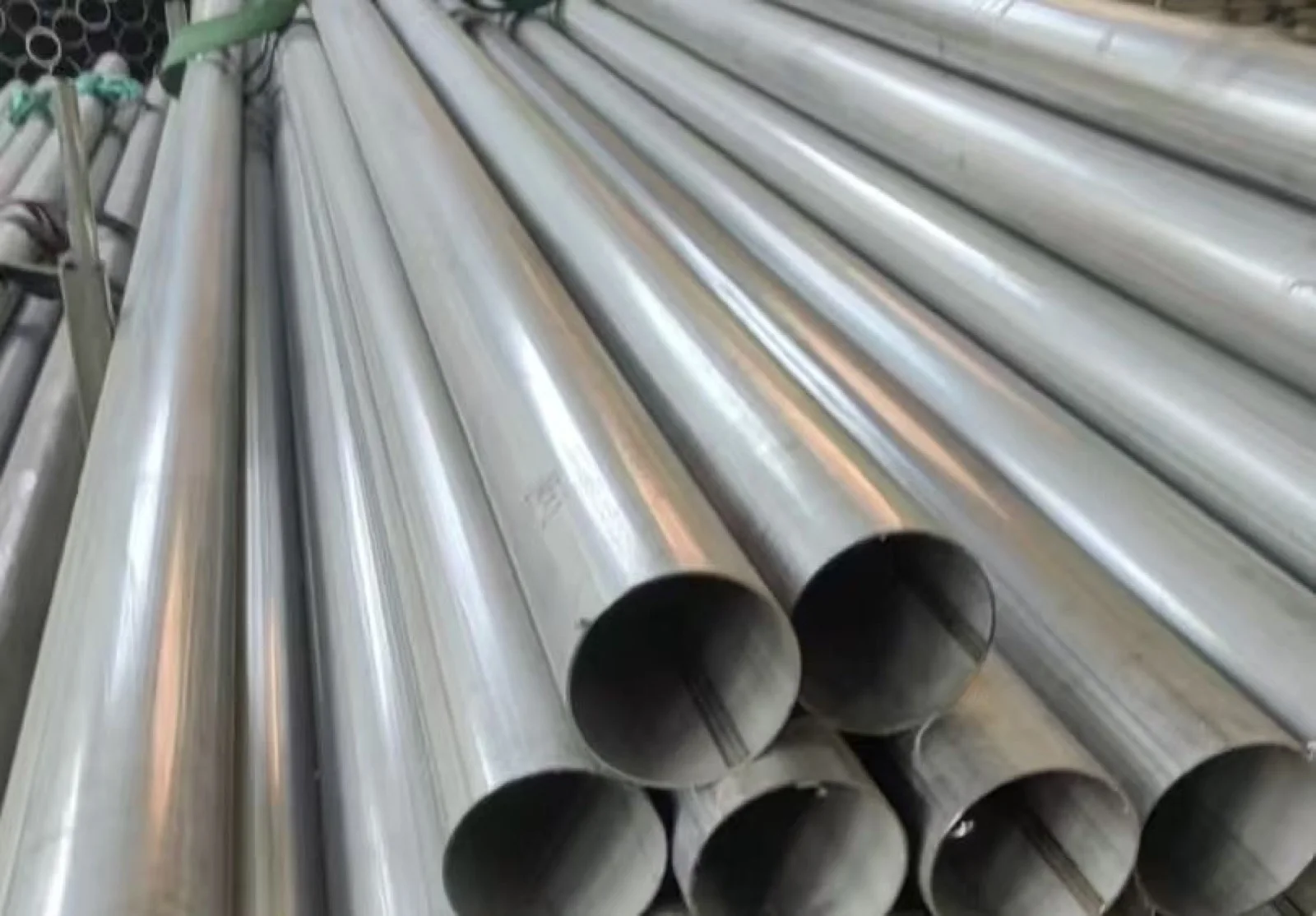 Round stainless steel tubes with longitudinal seams visible at the openings