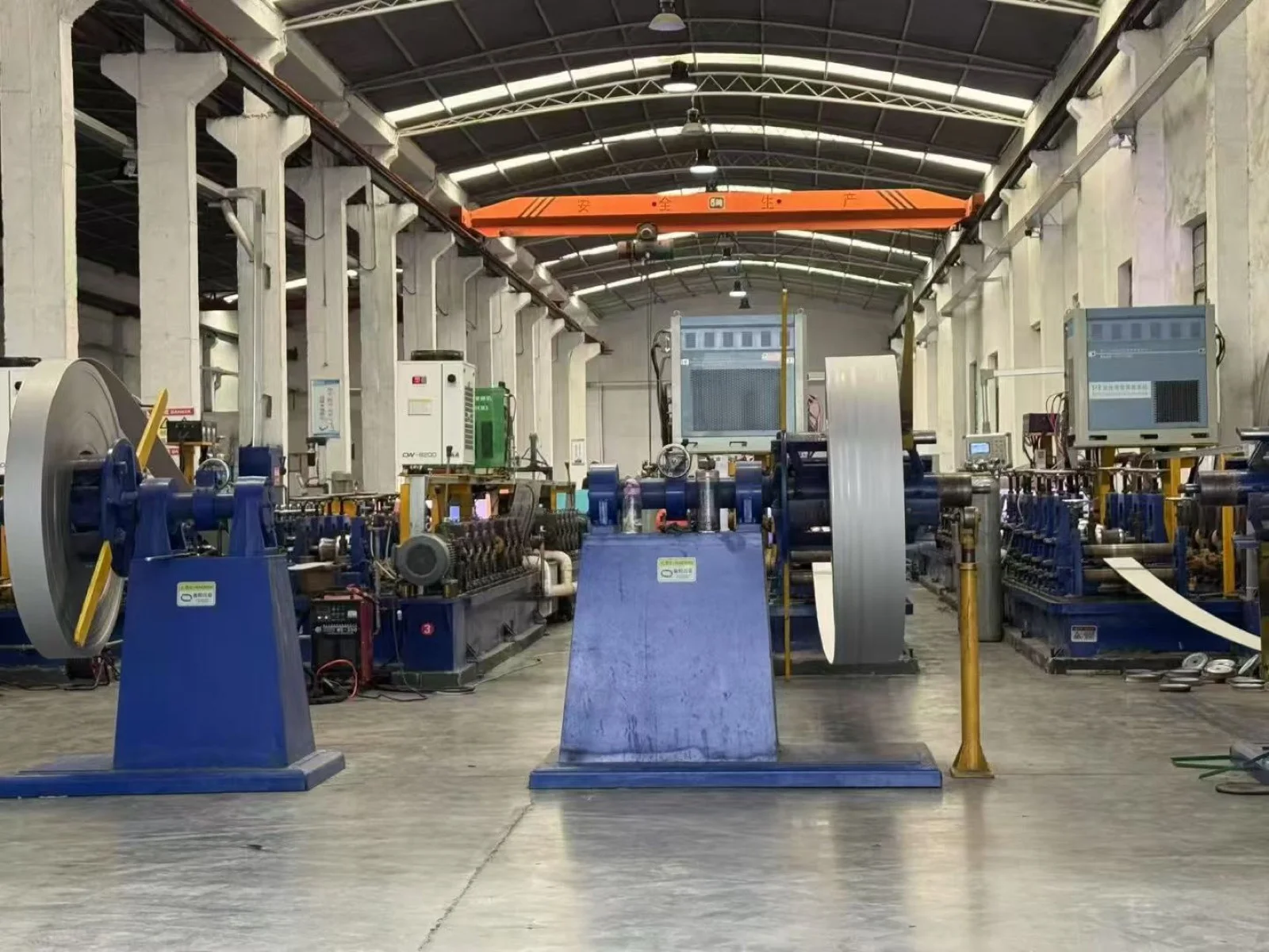 Coil-fed tube production equipment inside the AODSON workshop