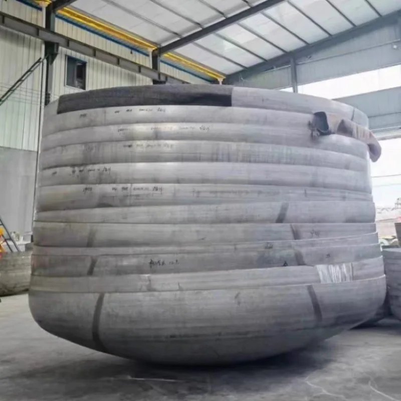 Close view of formed stainless tank head crown and edge